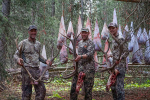 Successful elk hunt and hunters